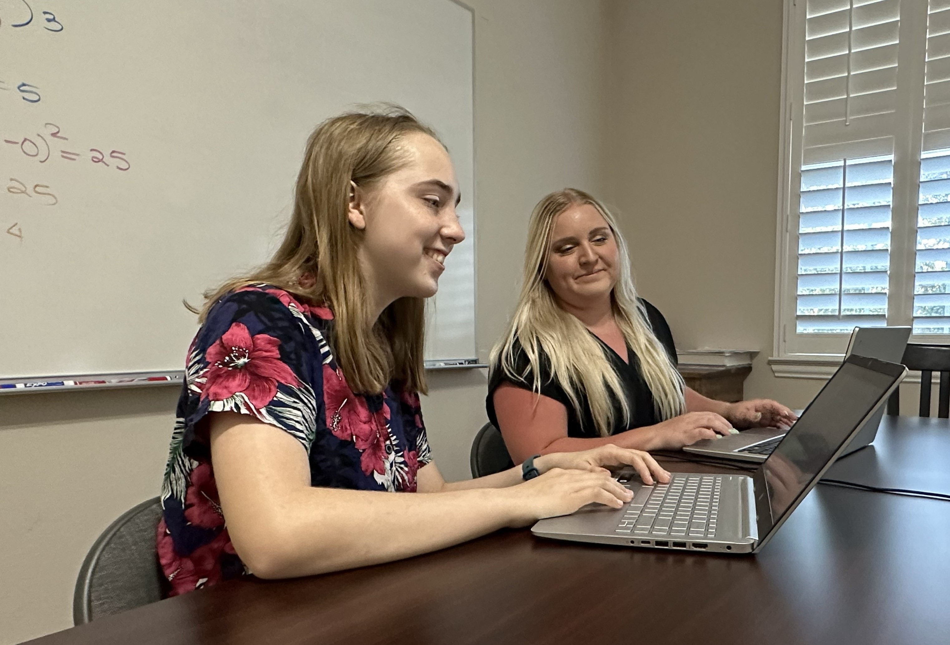 Students focused on tutoring work together